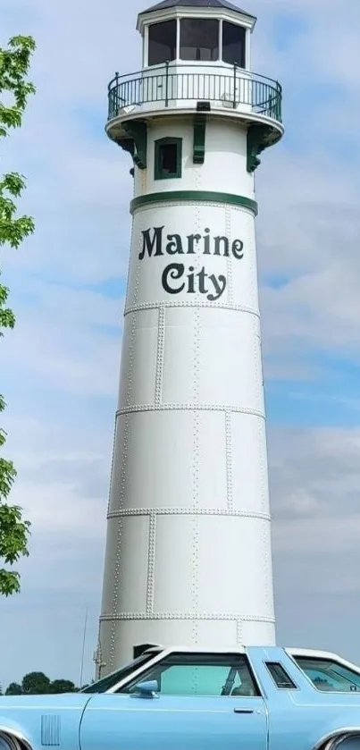 Marine City lighthouse with vintage car against a blue sky.