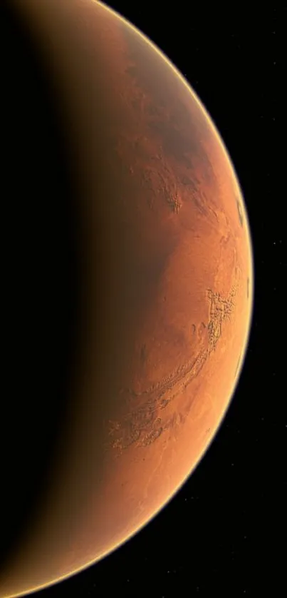 Mars surface viewed from space, showcasing red-brown terrain and a shadowed crescent.