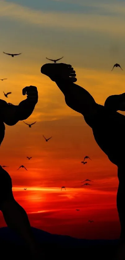 Silhouetted martial artists against a vivid sunset.