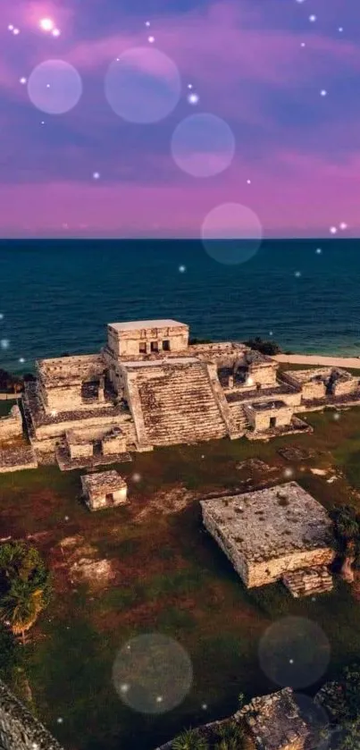 Mayan ruins with beach sunset in background.