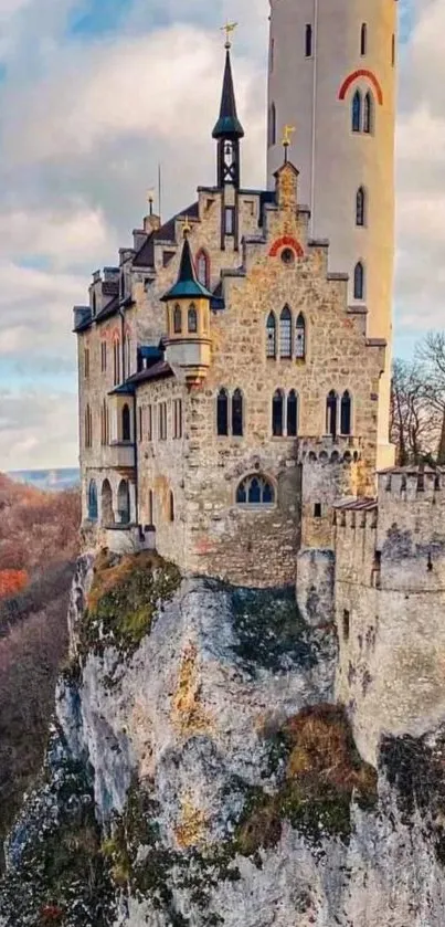 Medieval castle atop a cliff in scenic landscape.