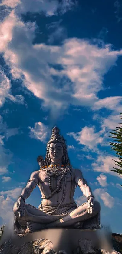 Shiva meditating under a blue sky, surrounded by clouds.