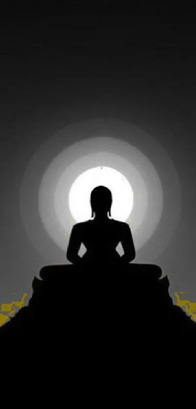 Silhouette of a meditative figure in a calm, dark setting with radiant light.