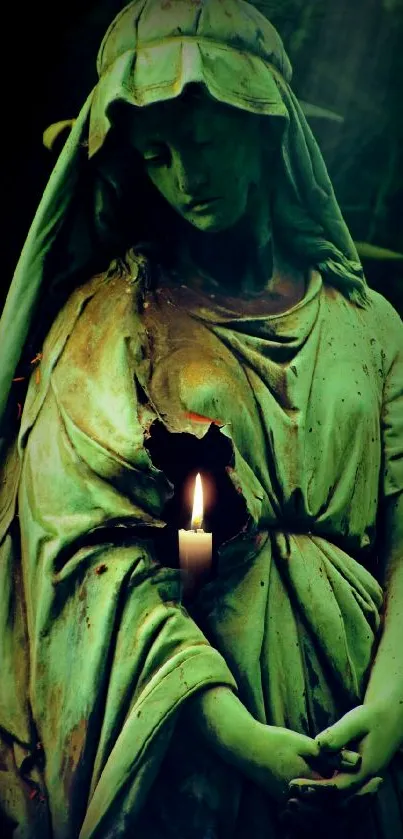 Statue illuminated by candlelight in dark green tones with serene ambiance.