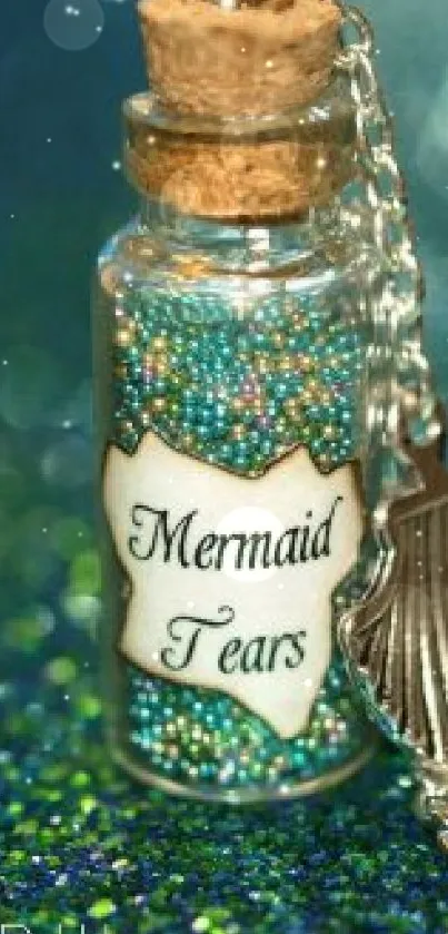 Glittering mermaid-themed bottle labeled 'Mermaid Tears' with seashell charm.