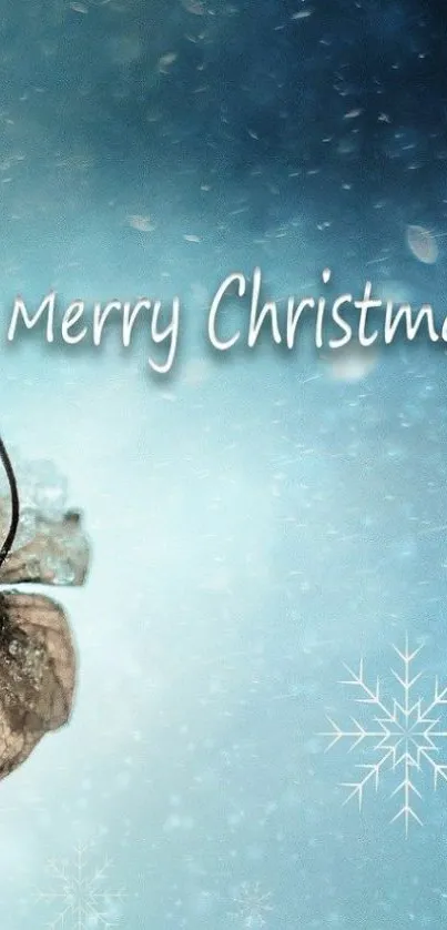 Merry Christmas text with wintery blue background and snowflakes.