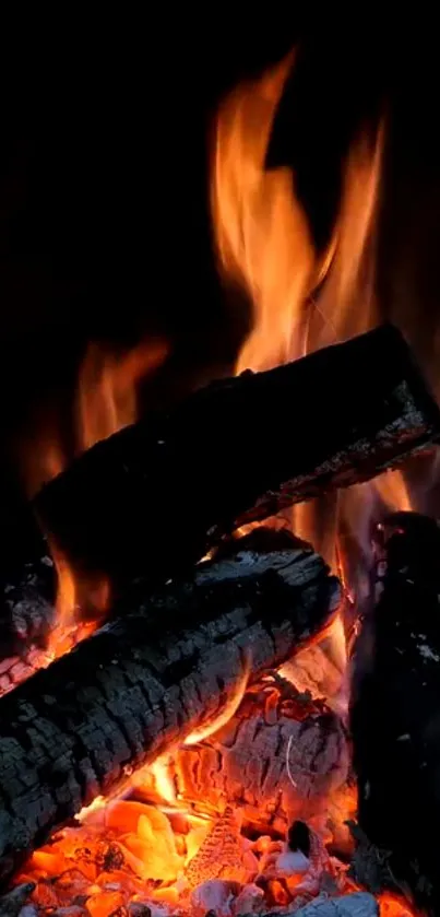 Warm and cozy fireplace with glowing logs and vibrant flames.