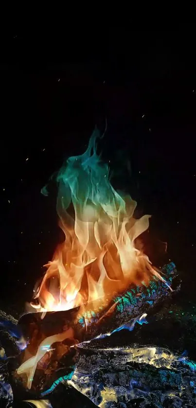 Colorful flames burning with vibrant hues of blue, green, and orange on logs.