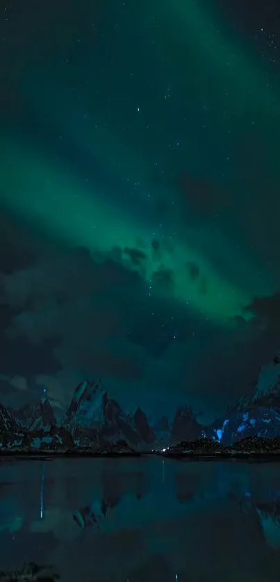 Northern Lights over mountains reflecting in a calm lake at night.