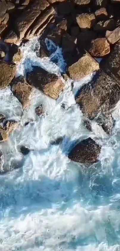 Aerial view of ocean waves crashing against rocks.