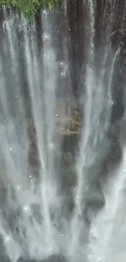 Mesmerizing waterfall with cascading water and lush greenery.