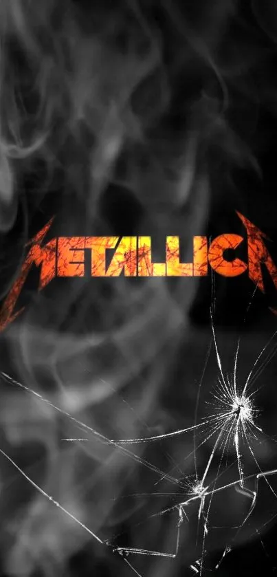 Metallica logo with smoke and cracked effect on black background.