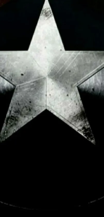 Metallic star on black background mobile wallpaper.