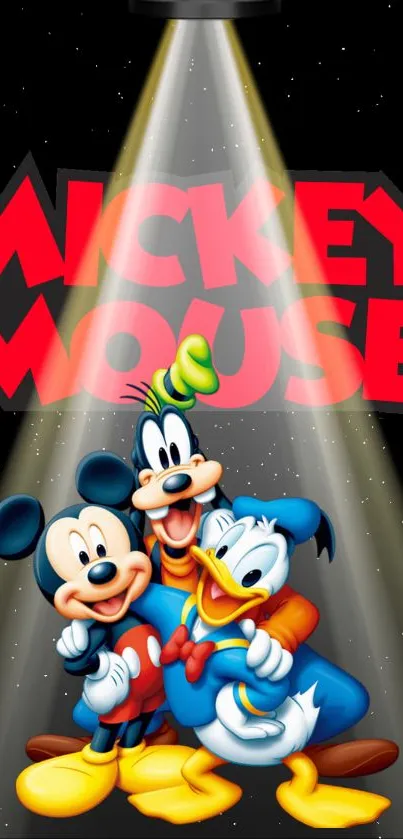 Mickey Mouse, Goofy, and Donald Duck under a spotlight on a black background.