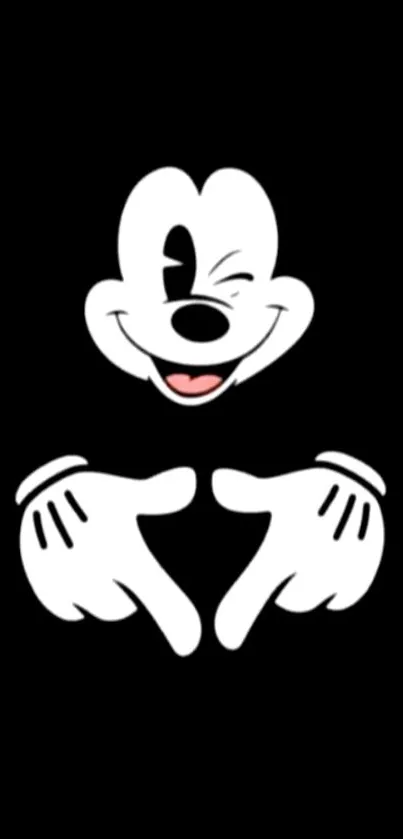 Mickey Mouse winking with heart hands on black background.