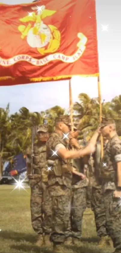 Military ceremony with red flag and soldiers on a sunny day.