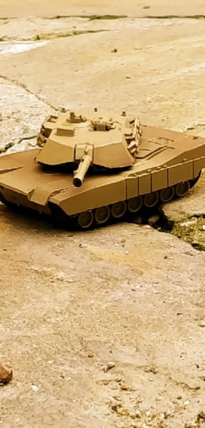 Realistic miniature tank on pavement background.