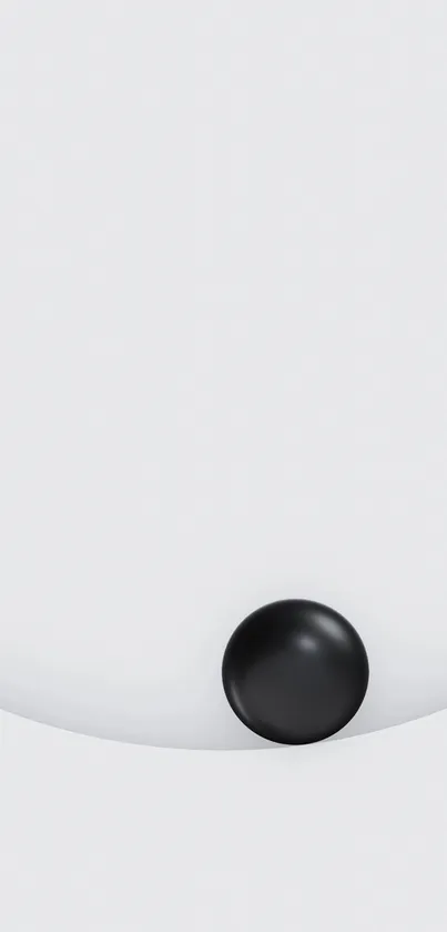 Minimalist wallpaper with a black sphere on a white background.