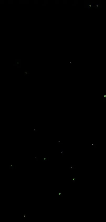 Black wallpaper with tiny glowing green dots giving a minimalistic starry effect.