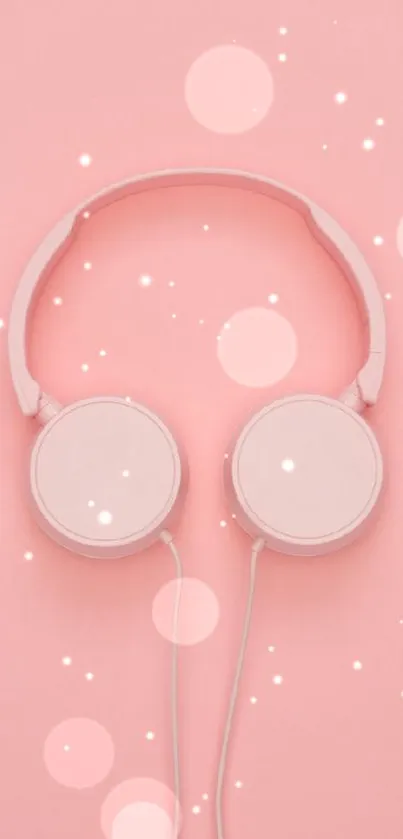 Minimalist pink wallpaper with white headphones.