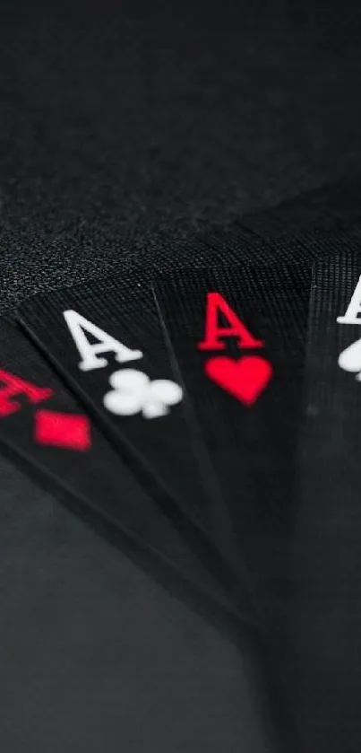 Stylish ace playing cards on black background wallpaper.