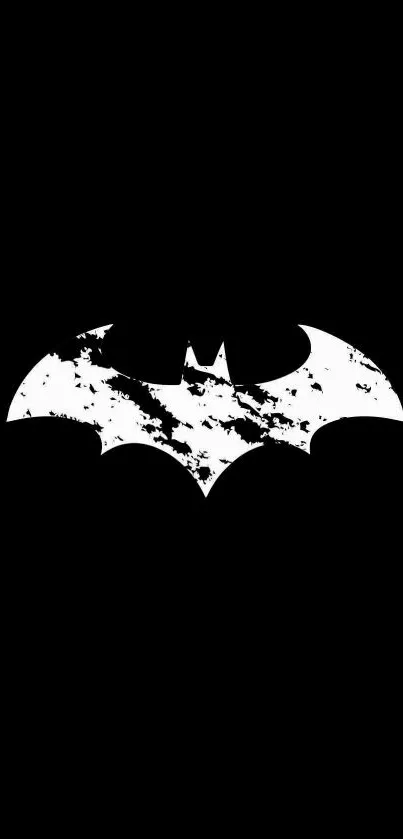 Black and white Batman logo on black background.