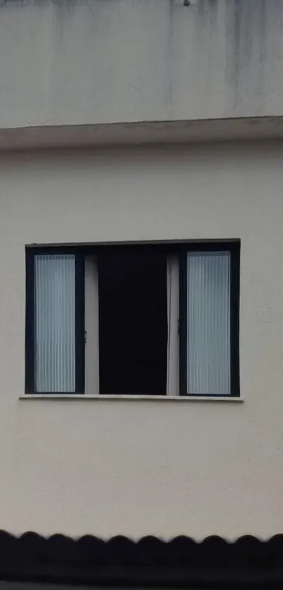 Minimalist beige wall with open window.