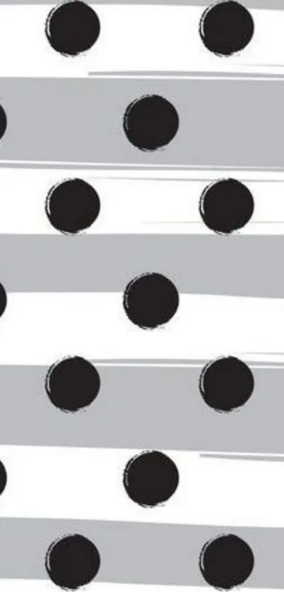 Gray background with black polka dots and stripes pattern.