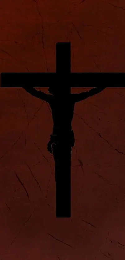 Silhouette of crucifix on brown textured background.