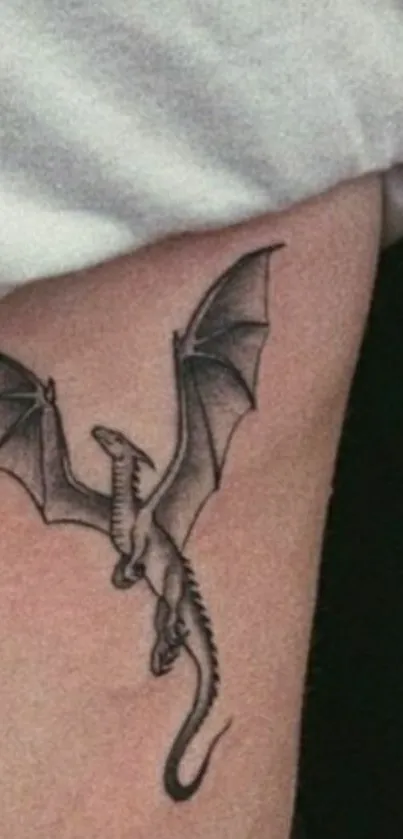 Minimalist dragon tattoo on skin, perfect for mobile wallpaper.