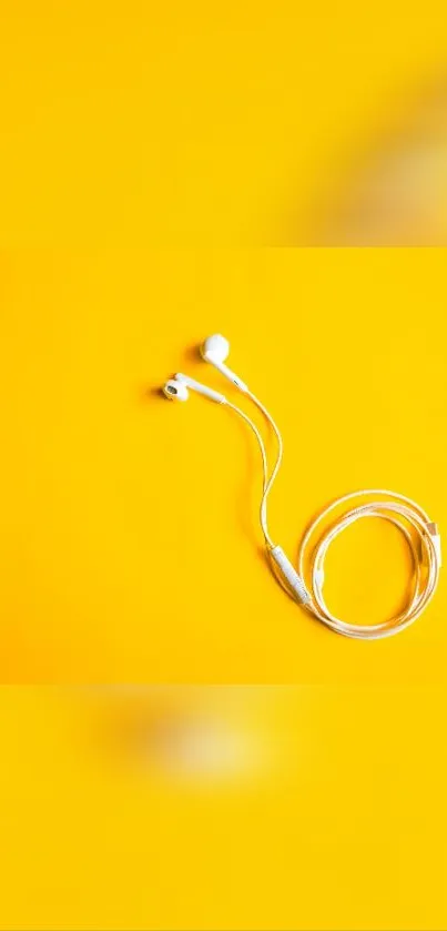 White earphones on a vibrant yellow background, minimalist design.