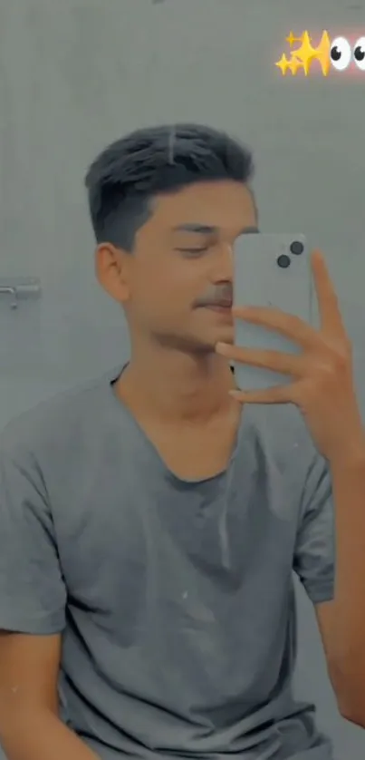 Young man taking a mirror selfie with smartphone.