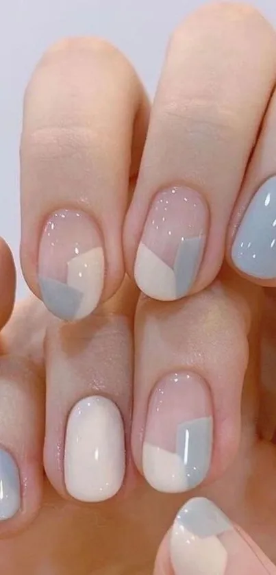 Minimalist pastel nail art with soft tones on mobile wallpaper.