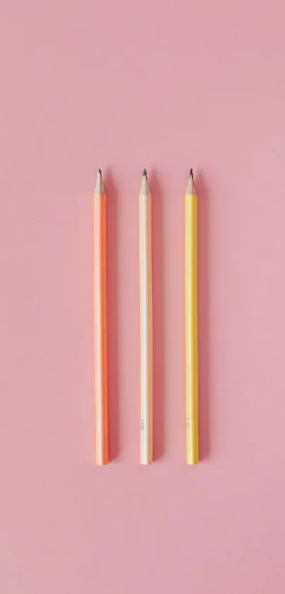 Minimalist pastel pencils on pink background wallpaper.