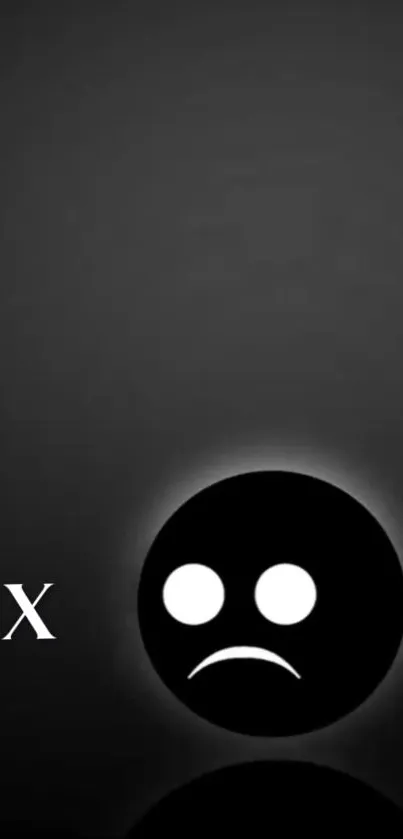 Minimalist wallpaper with a sad face emoji in black and gray tones.