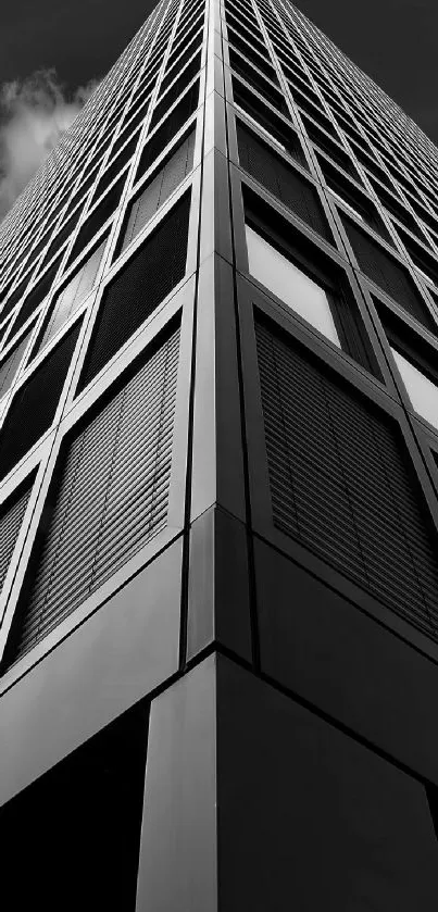 Monochrome photo of a modern skyscraper with sleek geometric lines.