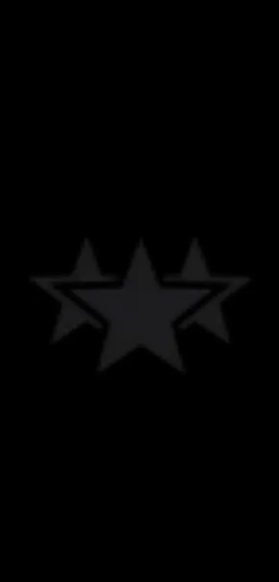 Minimalist black wallpaper with three star design.