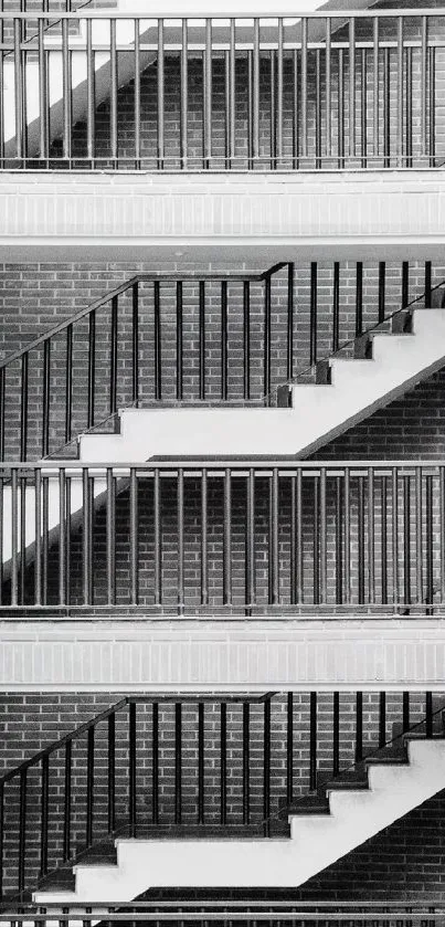 Black and white urban staircase with brick wall.