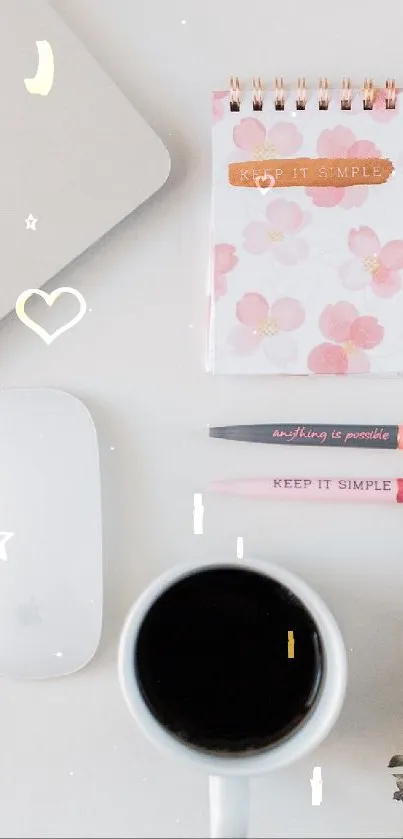 Minimalist workspace with laptop, coffee, and stationery.