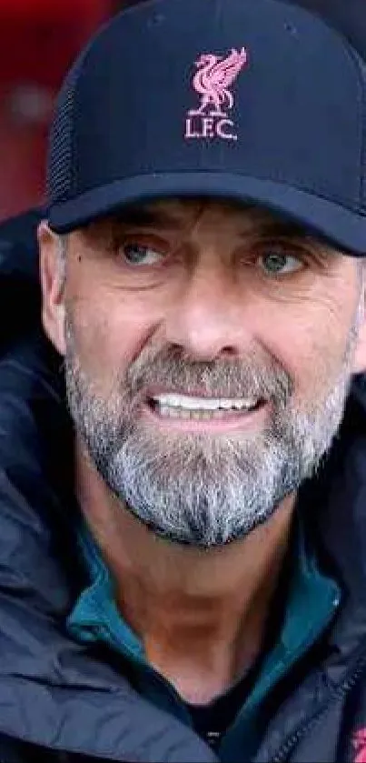 Portrait of a focused football coach in a stadium setting.