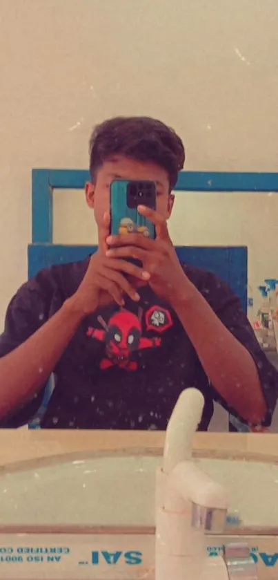 Mirror selfie with blue phone case in unique design.