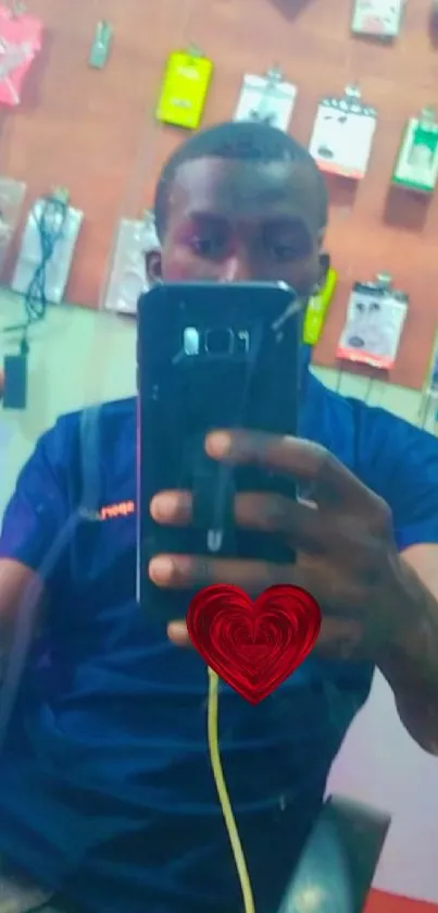 Mirror selfie with heart design on phone cover.