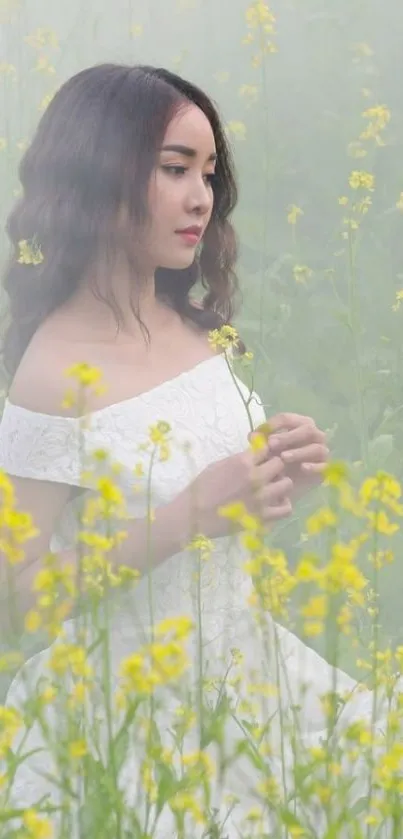 Woman in a misty field surrounded by yellow flowers, wearing a white dress.