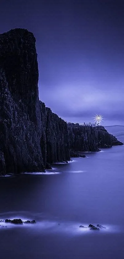 Misty nightscape with cliffs and a glowing lighthouse in deep blue hues.