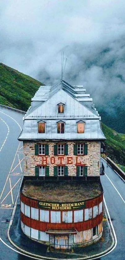 Vintage hotel on misty mountain road wallpaper.