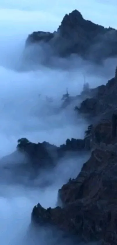 Misty mountain peaks surrounded by clouds.