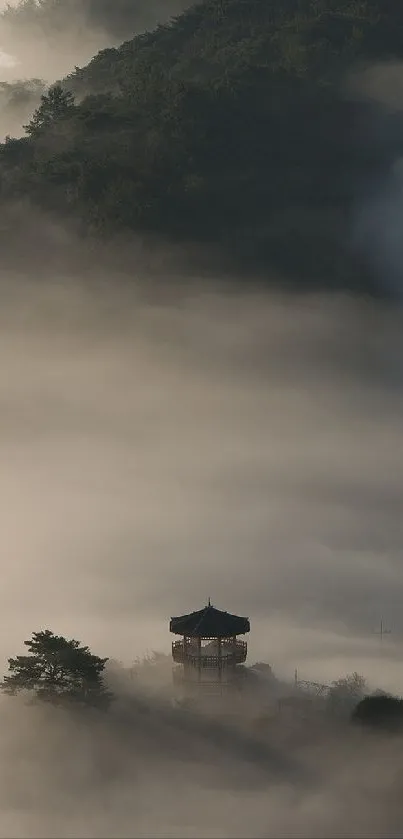 Misty mountain landscape shrouded in clouds.
