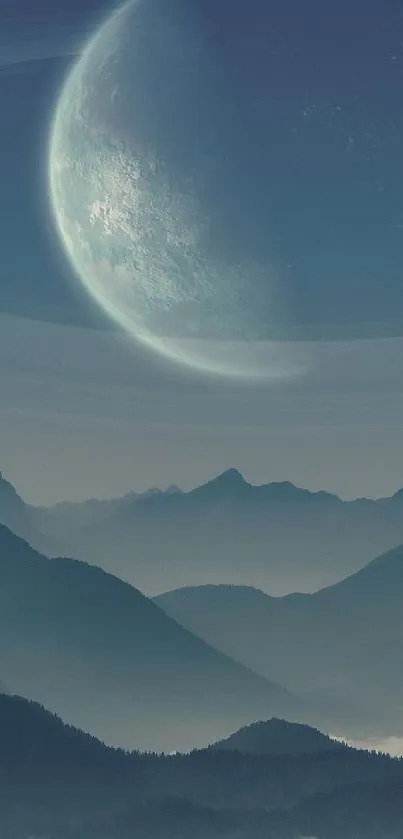 A digital wallpaper of misty blue mountains under a glowing moon.