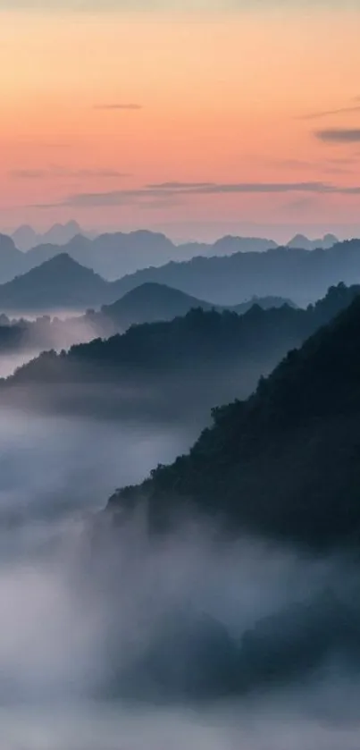 Misty mountain sunrise with vibrant colors.