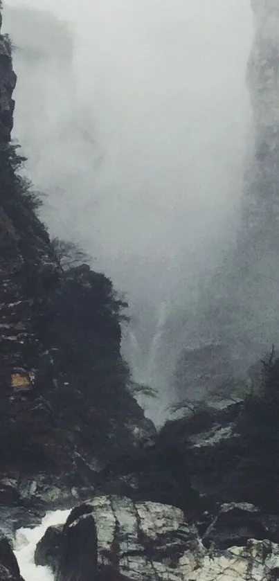 Misty mountain valley with fog and cliffs.